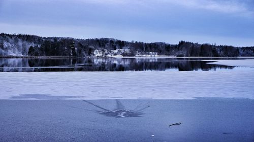 Scenic view of frozen lake against clear sky