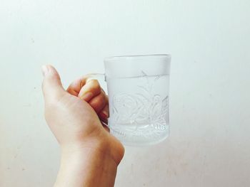 Close-up of hand holding paper