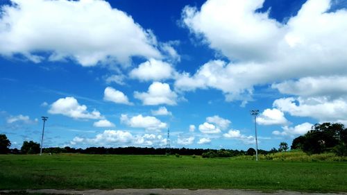 Countryside landscape against cloudy sky