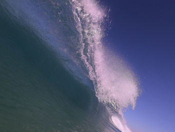 Wave in sea against sky