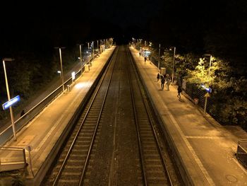 High angle view of railroad tracks at night
