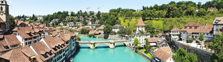 High angle view of river amidst buildings in city