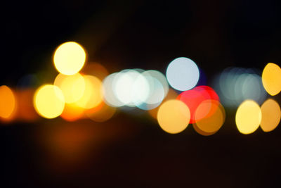 Defocused image of illuminated lights at night