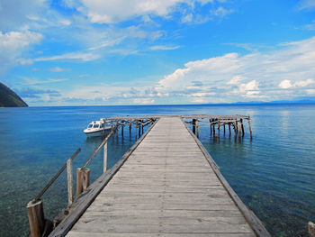 Pier over sea against sky