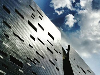 Low angle view of building against cloudy sky