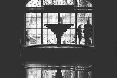 Silhouette of man in glass window
