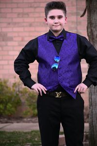 Portrait of smiling man standing against wall
