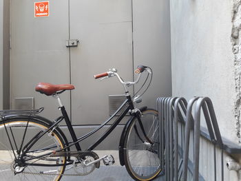 Bicycle parked against wall