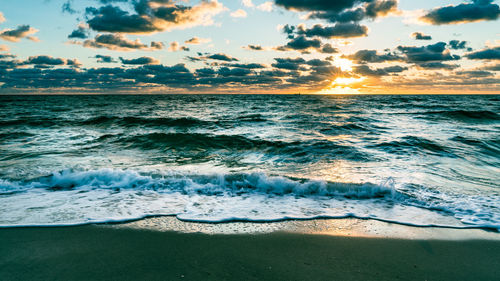 Scenic view of sea against sky during sunset