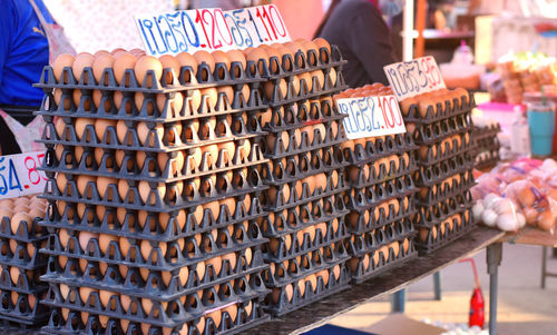 Eggs in multi-tier racks for sale