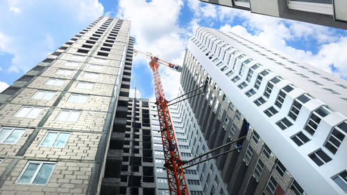 Low angle view of modern buildings against sky