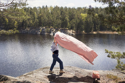 Full length of man standing in lake