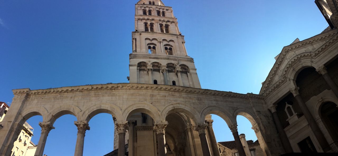 architecture, clear sky, built structure, building exterior, famous place, blue, low angle view, history, travel destinations, arch, tourism, international landmark, travel, religion, capital cities, place of worship, church, culture, copy space