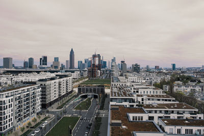 High angle view of modern buildings in city against sky