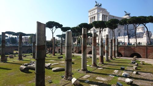 View of cemetery and building against sky