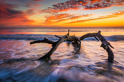 Scenic view of sea against sky during sunset