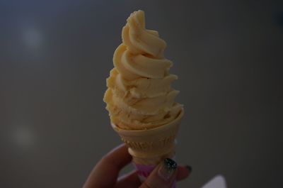 Close-up of hand holding ice cream