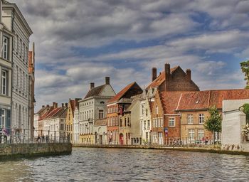 Houses in city against sky