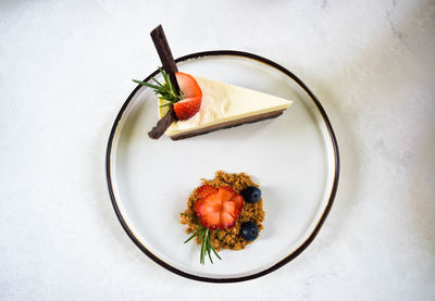 High angle view of fruit in plate on table