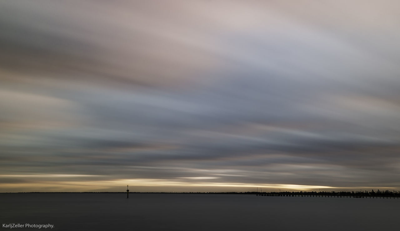 SCENIC VIEW OF LAKE AGAINST SUNSET SKY