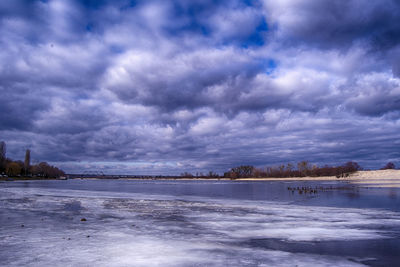 Scenic view of sea against cloudy sky