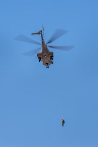 Rescue helicopter training near venguera, gran canaria on march 10, 2022. one unidentified person