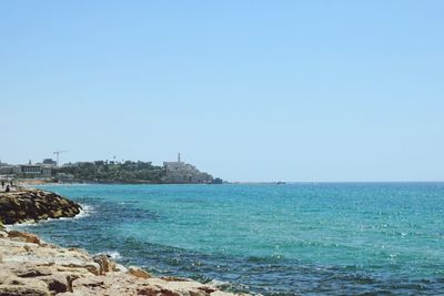 Scenic view of sea against clear blue sky