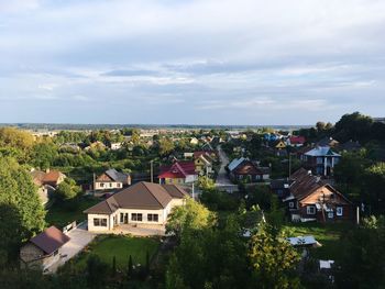 Houses in town against sky