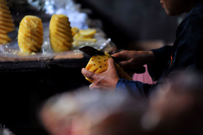 Midsection of man preparing food