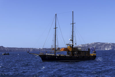 Santorini, greece, may 4, 2024. traditional sailing boat for tourists in the port of fira