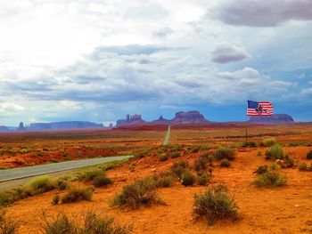 Scenic view of landscape against cloudy sky