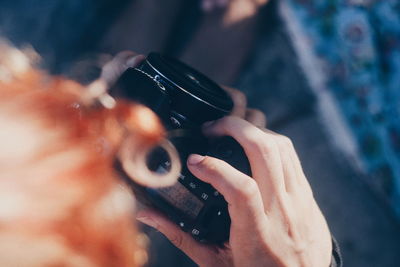 Close-up of hand holding camera