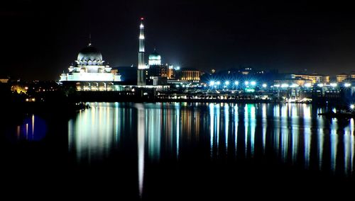 Reflection of illuminated buildings in water at night