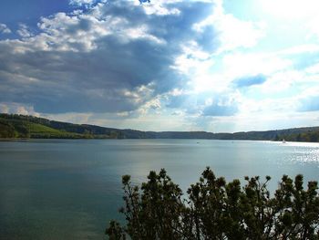 Scenic view of lake against cloudy sky