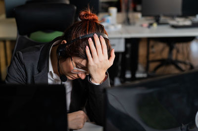 Depressed businesswoman sitting in office