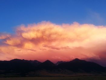 Scenic view of mountains against sky at sunset