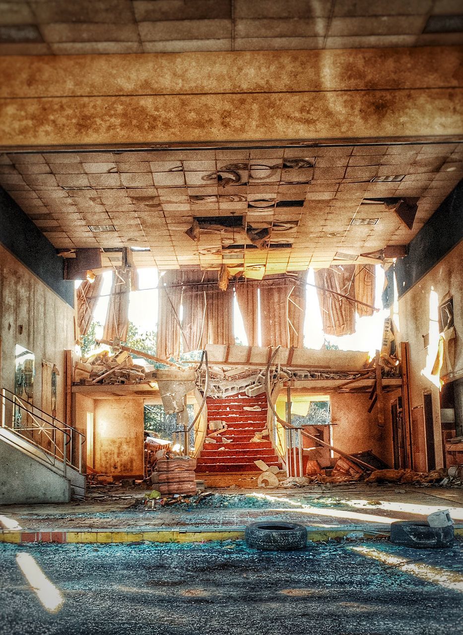 architecture, built structure, abandoned, obsolete, indoors, building exterior, old, deterioration, run-down, damaged, weathered, building, ceiling, interior, wall - building feature, house, bad condition, messy, graffiti, illuminated