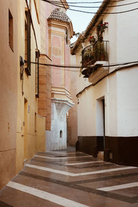 Alley amidst buildings in city