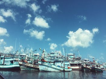 Boats moored at harbor