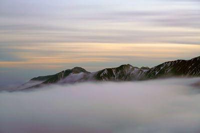 Scenic view of mountain against sky during sunset