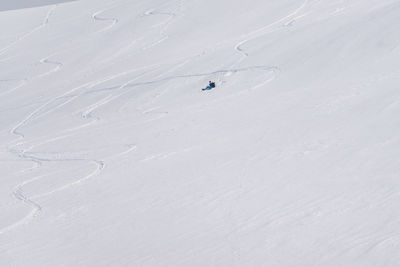 High angle view of people skiing on field during winter