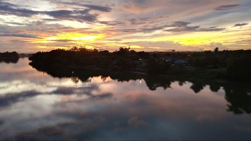 Scenic view of lake against sky during sunset