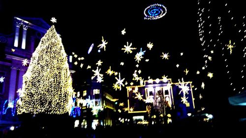 Low angle view of illuminated building at night