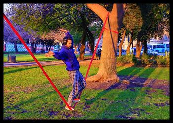 Girl swinging in park