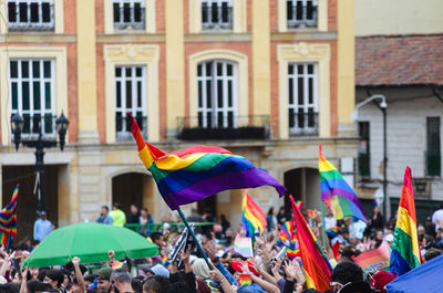 People in front of building with lgbtiq demonstration 