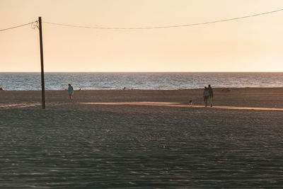 Scenic view of sea against clear sky during sunset