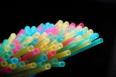 Close-up of multi colored lights against black background