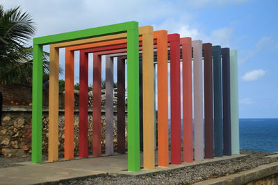 Built structure on beach against sky