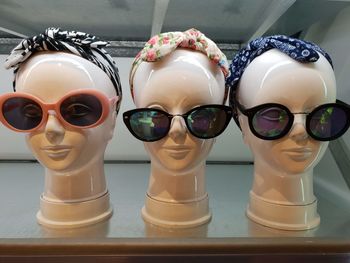 Close-up of headscarf and sunglasses on mannequins