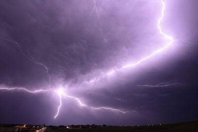 Low angle view of lightning in sky at night